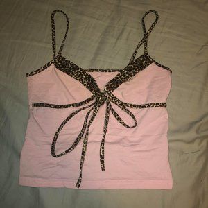 Y2K style pink crop tank top with leopard print straps, lining and bow